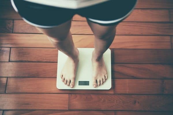 woman weighing herself